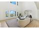 Spacious living room with high ceilings, clerestory windows and stylish furniture at 9408 Players Canyon Ct, Las Vegas, NV 89144