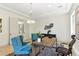 Bright office featuring a wood desk, modern chandelier, and twin plush chairs at 9408 Players Canyon Ct, Las Vegas, NV 89144