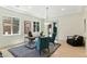 Bright home office featuring a hardwood floor, modern furniture, and ample natural light at 9408 Players Canyon Ct, Las Vegas, NV 89144