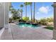 Relaxing pool with mature palm trees and nice yard at 9408 Players Canyon Ct, Las Vegas, NV 89144