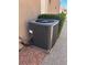 Well-maintained air conditioning unit surrounded by manicured greenery on a gravel base at 10036 Keysborough Dr, Las Vegas, NV 89134