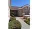 Charming front yard with manicured landscaping and a welcoming walkway to the front door at 10036 Keysborough Dr, Las Vegas, NV 89134