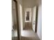 Bright hallway with tiled floors and doors leading to various rooms at 10036 Keysborough Dr, Las Vegas, NV 89134
