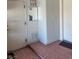 Hallway featuring a closet, door, and a mirror on the wall at 10036 Keysborough Dr, Las Vegas, NV 89134