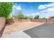 Expansive back yard area with potential for landscaping and outdoor living, enclosed by a brick wall at 10045 Natchez Trace St, Las Vegas, NV 89178
