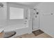 This bathroom features a glass shower door with a shower head and a bathtub at 10045 Natchez Trace St, Las Vegas, NV 89178