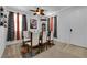 Stylish dining room with a modern glass table and seating for six, perfect for entertaining at 10045 Natchez Trace St, Las Vegas, NV 89178
