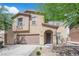Charming home with two-car garage, low maintenance landscaping, and beautiful curb appeal at 10045 Natchez Trace St, Las Vegas, NV 89178