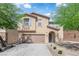 Charming home with two-car garage, low maintenance landscaping, and beautiful curb appeal at 10045 Natchez Trace St, Las Vegas, NV 89178
