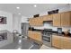 Bright kitchen area showcasing granite counters, stainless appliances, and a breakfast bar at 10045 Natchez Trace St, Las Vegas, NV 89178