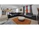 Open-concept living room with large sectional sofa and ample natural light for entertaining at 10045 Natchez Trace St, Las Vegas, NV 89178