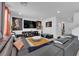 Open-concept living room with large sectional sofa and ample natural light for entertaining at 10045 Natchez Trace St, Las Vegas, NV 89178