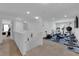 A second-floor recreation room with free weights, workout equipment, and a television at 10045 Natchez Trace St, Las Vegas, NV 89178