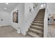 A view of a carpeted staircase leading to the upper level at 10045 Natchez Trace St, Las Vegas, NV 89178