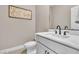 Stylish powder room featuring modern fixtures, a sleek vanity, and elegant decor for guests at 10301 Fairview Ridge Ct, Las Vegas, NV 89166