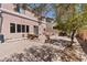 Backyard with open patio, greenery, and hardscape at 10478 Beallsville St, Las Vegas, NV 89141