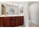 Bathroom with a double vanity, shower, and tile flooring at 10478 Beallsville St, Las Vegas, NV 89141