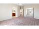 Bright bedroom with closet doors, a connecting bathroom, and neutral color palette at 10478 Beallsville St, Las Vegas, NV 89141