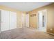 Bedroom with neutral walls, carpeted floors, and large closet doors for ample storage at 10478 Beallsville St, Las Vegas, NV 89141