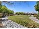 A manicured community park with mature shade trees and walking paths for residents to enjoy at 10478 Beallsville St, Las Vegas, NV 89141