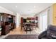 Open concept dining and kitchen area with ample natural light and black appliances at 10478 Beallsville St, Las Vegas, NV 89141