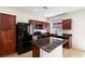 Modern kitchen with stainless steel appliances and an island counter at 10478 Beallsville St, Las Vegas, NV 89141