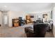 Cozy living room with comfortable seating, media center, and natural light at 10478 Beallsville St, Las Vegas, NV 89141