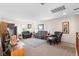 Comfortable living room featuring ample seating and a view of the outside at 10478 Beallsville St, Las Vegas, NV 89141