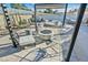 Backyard with a pergola, fire pit, gravel, desert landscaping, modern seating, and stylish outdoor decor at 105 Shadow Ln, Las Vegas, NV 89106
