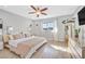 A well-lit bedroom with natural light, wood floors, and a minimalist design at 105 Shadow Ln, Las Vegas, NV 89106