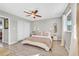 Bright bedroom with natural light, ceiling fan, and wood-look flooring at 105 Shadow Ln, Las Vegas, NV 89106