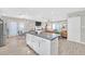 Open-concept living room featuring a large island, modern decor, and lots of light at 105 Shadow Ln, Las Vegas, NV 89106