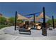 Community playground with colorful slides and climbing structures, shaded by modern canopies, perfect for outdoor recreation at 10693 Harvest Green Way, Las Vegas, NV 89135