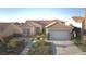 Charming single-story home with a well-manicured lawn and a two-car garage at 10717 Grand Cypress Ave, Las Vegas, NV 89134