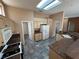 Eat-in kitchen featuring tile floors, granite countertops, ample cabinetry, and stainless steel appliances at 10717 Grand Cypress Ave, Las Vegas, NV 89134