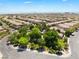 Desirable community featuring lush green spaces, mature trees, and well-maintained homes with terracotta roofs at 11901 Luna Del Mar Ln, Las Vegas, NV 89138