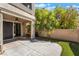 View of backyard showing artificial turf, block wall, and covered patio area at 11901 Luna Del Mar Ln, Las Vegas, NV 89138