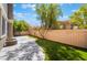 Artificial grass and block wall define the backyard, creating a private and inviting outdoor space at 11901 Luna Del Mar Ln, Las Vegas, NV 89138