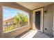 Comfortable balcony with a screen door, light fixture, and a wrought iron railing at 11901 Luna Del Mar Ln, Las Vegas, NV 89138