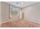 Bright bedroom filled with natural light from the window featuring neutral walls and carpet at 11901 Luna Del Mar Ln, Las Vegas, NV 89138