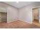 Neutral bedroom featuring carpet, a closet, and easy access to the home at 11901 Luna Del Mar Ln, Las Vegas, NV 89138