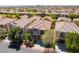 Desirable two-story home boasts great curb appeal, a private driveway, and mature landscaping at 11901 Luna Del Mar Ln, Las Vegas, NV 89138