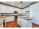 Modern kitchen with white cabinets, granite countertops and stainless steel appliances at 11901 Luna Del Mar Ln, Las Vegas, NV 89138