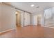 Spacious living room with tile flooring and sliding barn doors at 11901 Luna Del Mar Ln, Las Vegas, NV 89138