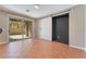 Spacious living room with tile flooring, a sliding glass door and barn door at 11901 Luna Del Mar Ln, Las Vegas, NV 89138