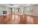 Bright living room features hardwood floors, a fireplace, and ample natural light at 11901 Luna Del Mar Ln, Las Vegas, NV 89138