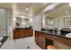 Elegant bathroom with dual sinks, granite counters, walk-in shower and separate soaking tub at 135 E Harmon Ave # 2821, Las Vegas, NV 89109