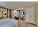 Bright bedroom features cozy seating area with large windows and carpeted floor at 135 E Harmon Ave # 2821, Las Vegas, NV 89109