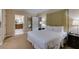 Bedroom featuring two lamps, a tufted headboard, and ensuite bathroom at 135 E Harmon Ave # 2821, Las Vegas, NV 89109