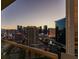 Balcony view of the vibrant city skyline at dusk, with prominent buildings at 135 E Harmon Ave # 2821, Las Vegas, NV 89109